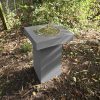 Contemporary Sundial in garden corner charcoal